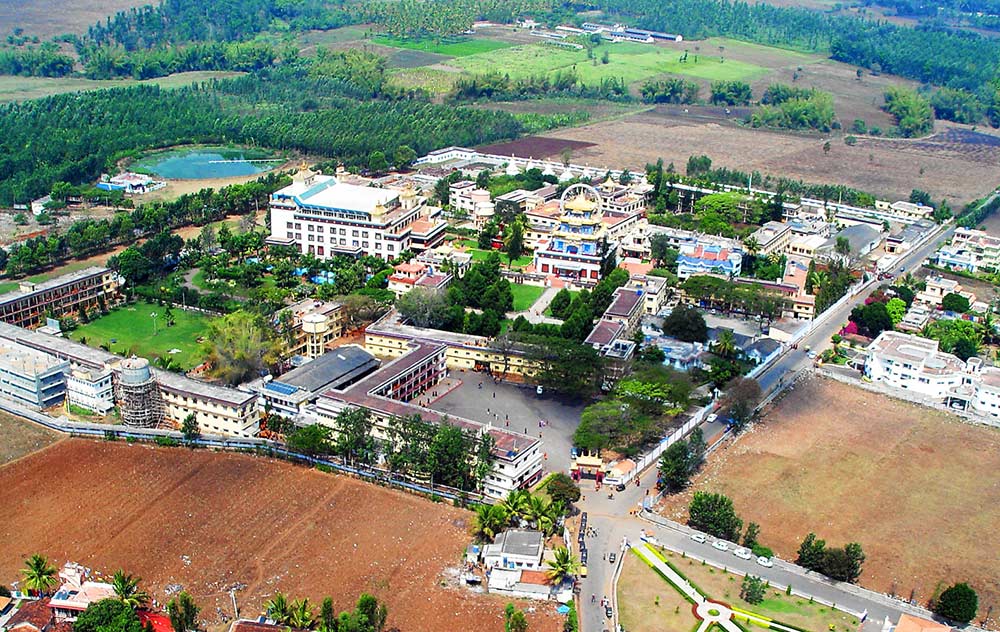 Palyul Namdroling Monastery complex near Mysore, South India. Built by H.H. Penor Rinpoche, after fleeing Tibet in 1959. It contains The Golden Temple, the Zangdokpelri temple, a Shedra, complex, 3-year retreat space, and a similar Nunnery complex a half mile down the road. The temple currently houses approximately 5000 monks.