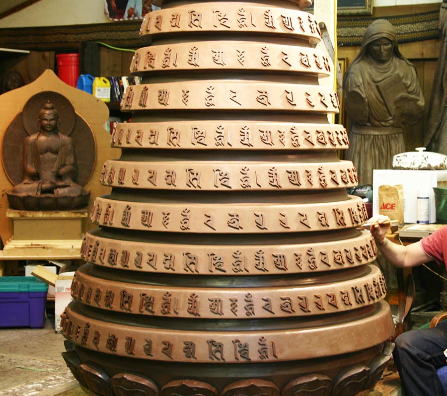 Mantra (prayers) embossed on the spire. This is a mold. It was then cast in bronze. We were fortunate John Soderberg shared his expertise, and working space!