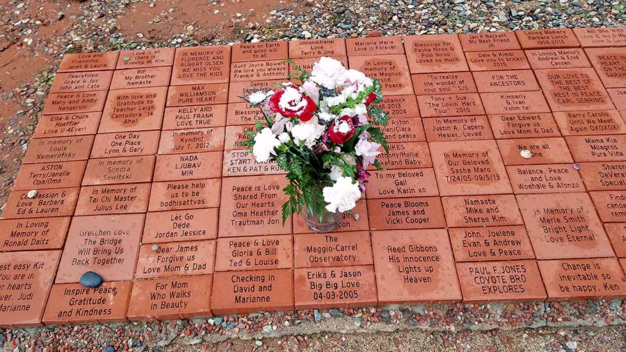 Visitors sponsor inscribed dedications on bricks forming the Path to Peace at the Amitabh Stupa in Sedona Arizona.