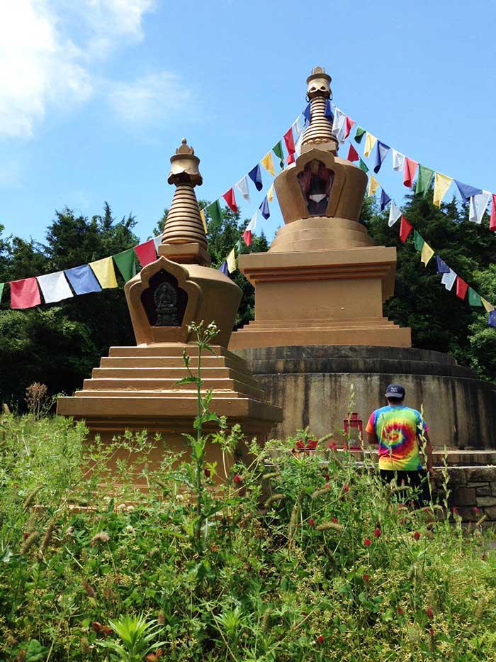 Volunteer working in the Long Life Stupa park at KPC Maryland.