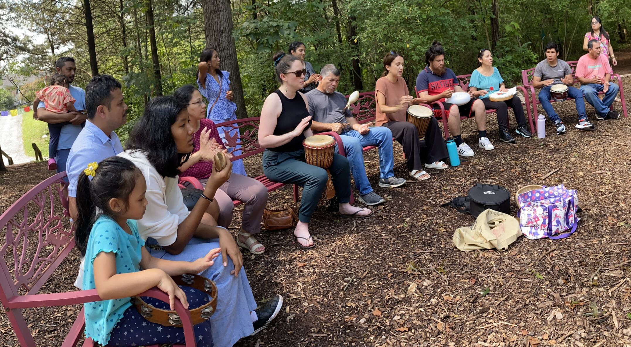 People of all ages enjoying a drum circle at KPC
