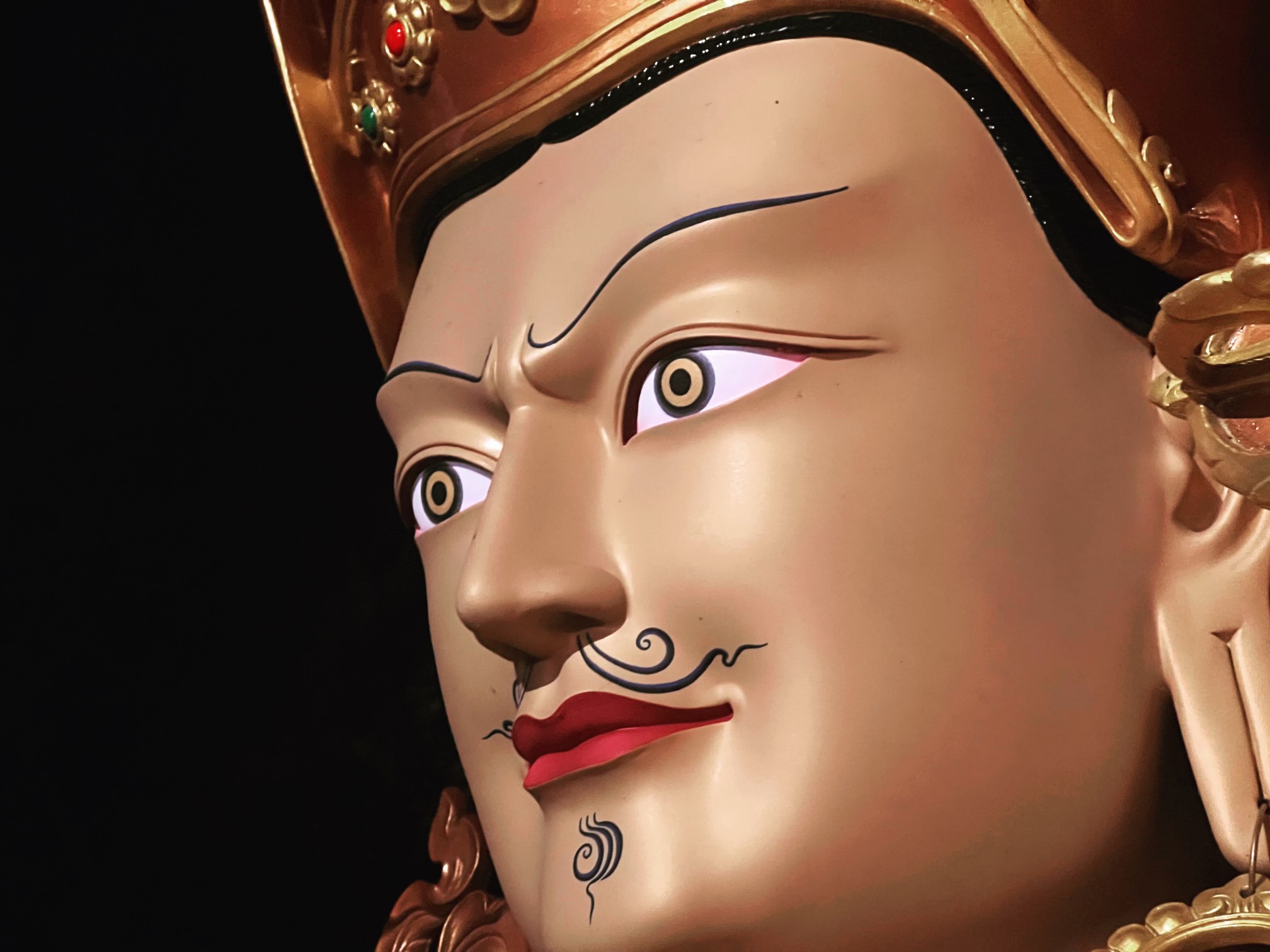 close-up of Guru Rinpoche statue's face